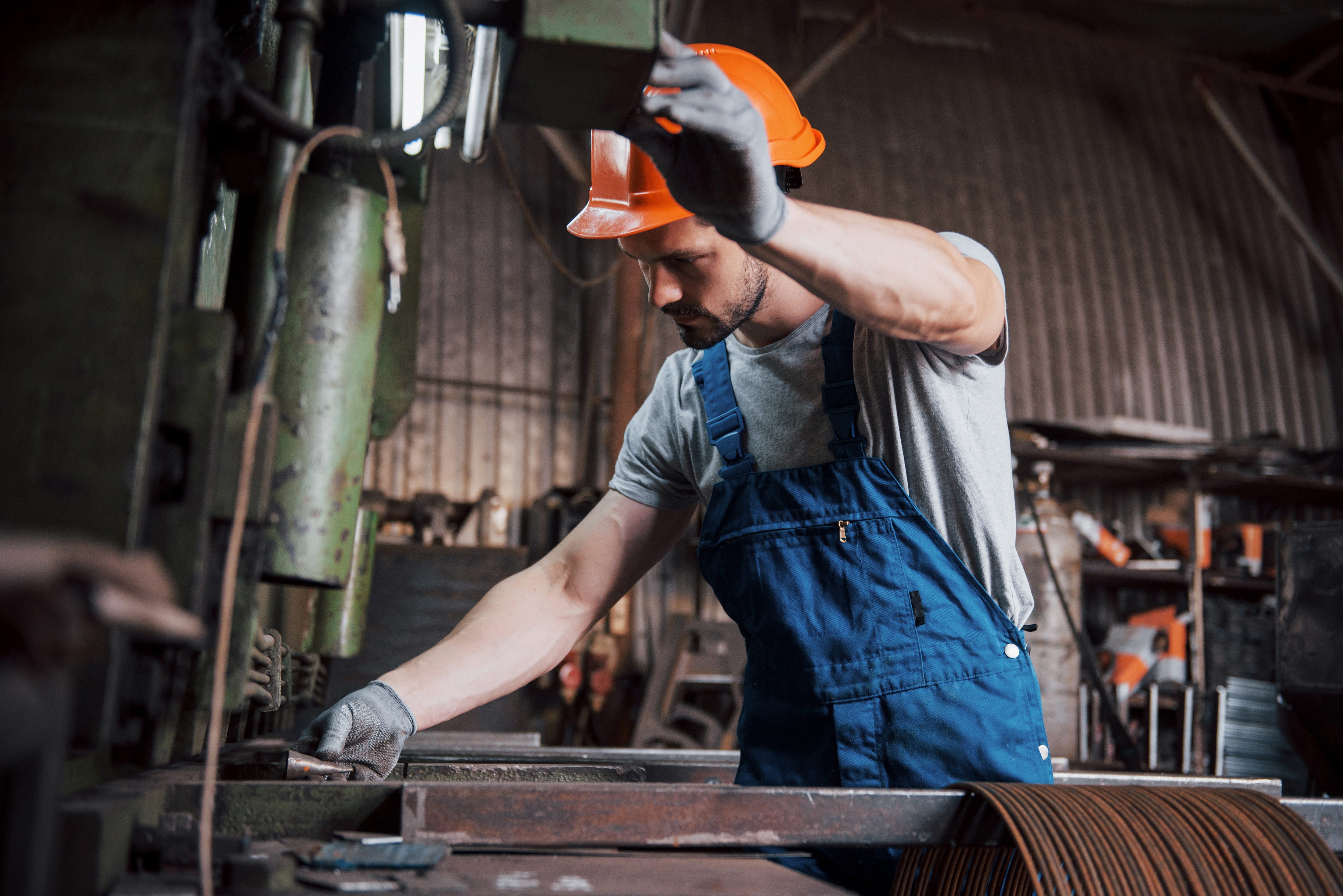 portrait-young-worker-hard-hat-large-metalworking-plant
